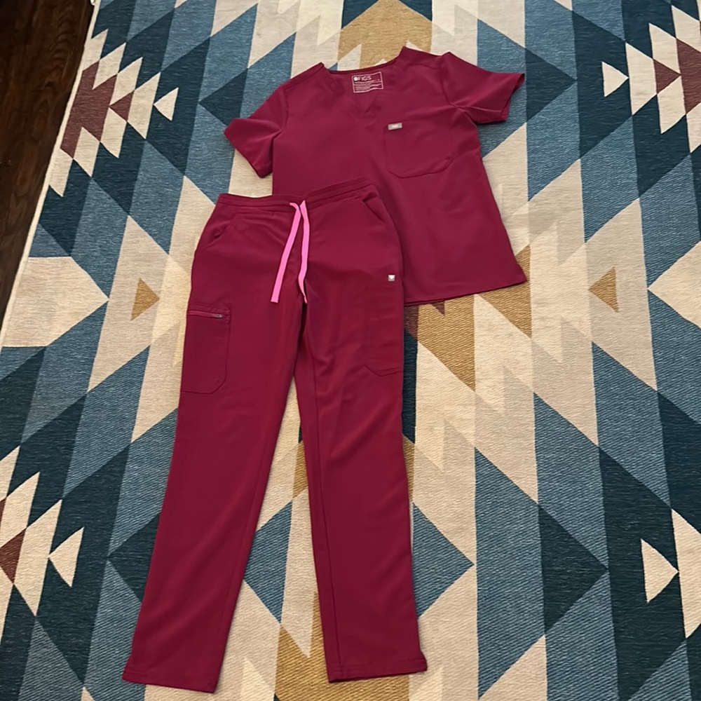 Women’s dark magenta FIGS scrub set.